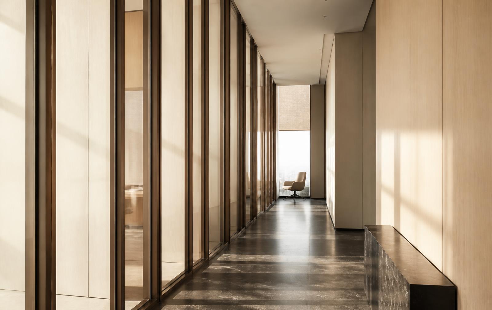 Quiet sunlit corridor inside a modern professional services office